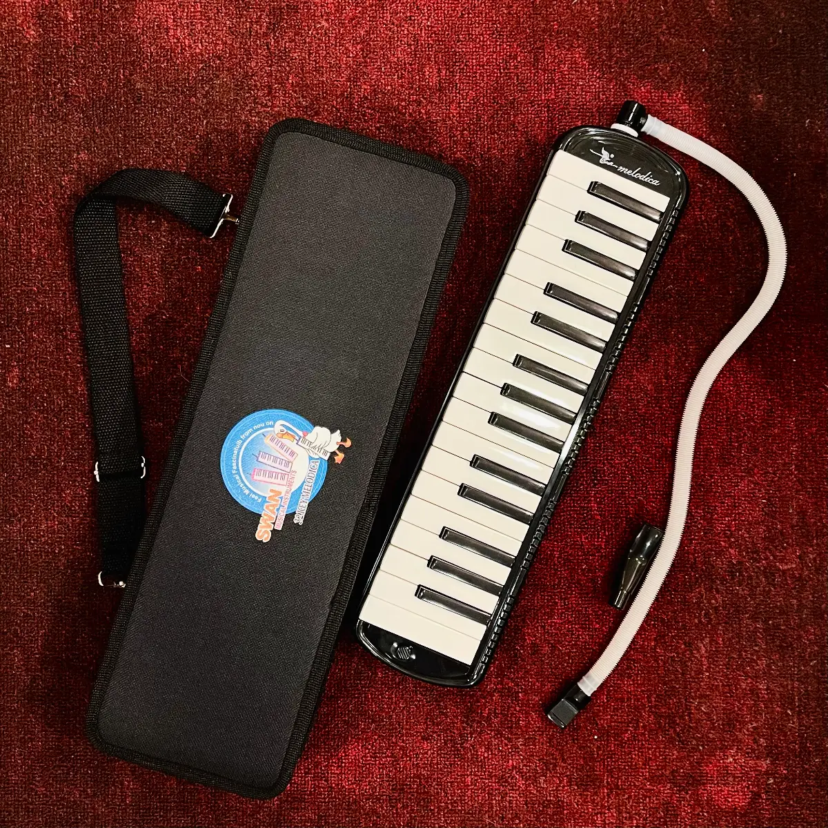 ken phim melodica swan sw32j-4 32 mau den hop vai