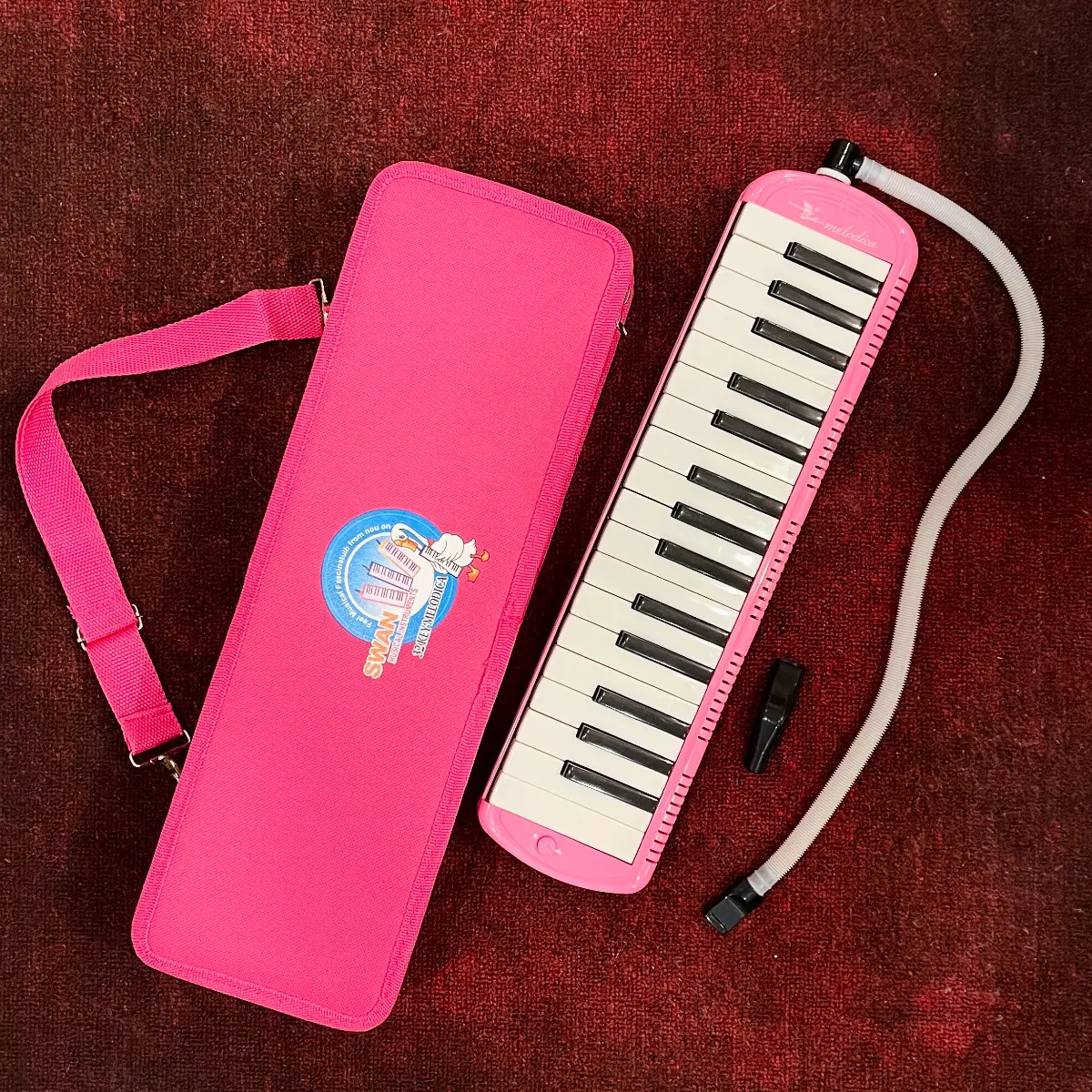 ken phim melodica swan sw32j-4 32 mau hong hop vai