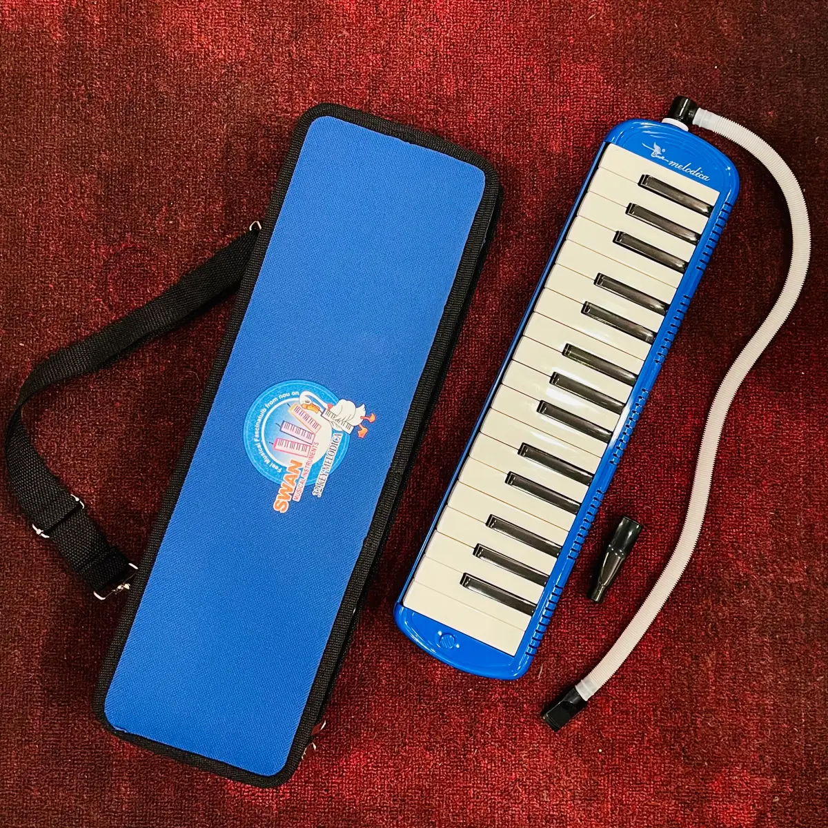 ken phim melodica swan sw32j-4 32 mau xanh dam hop vai